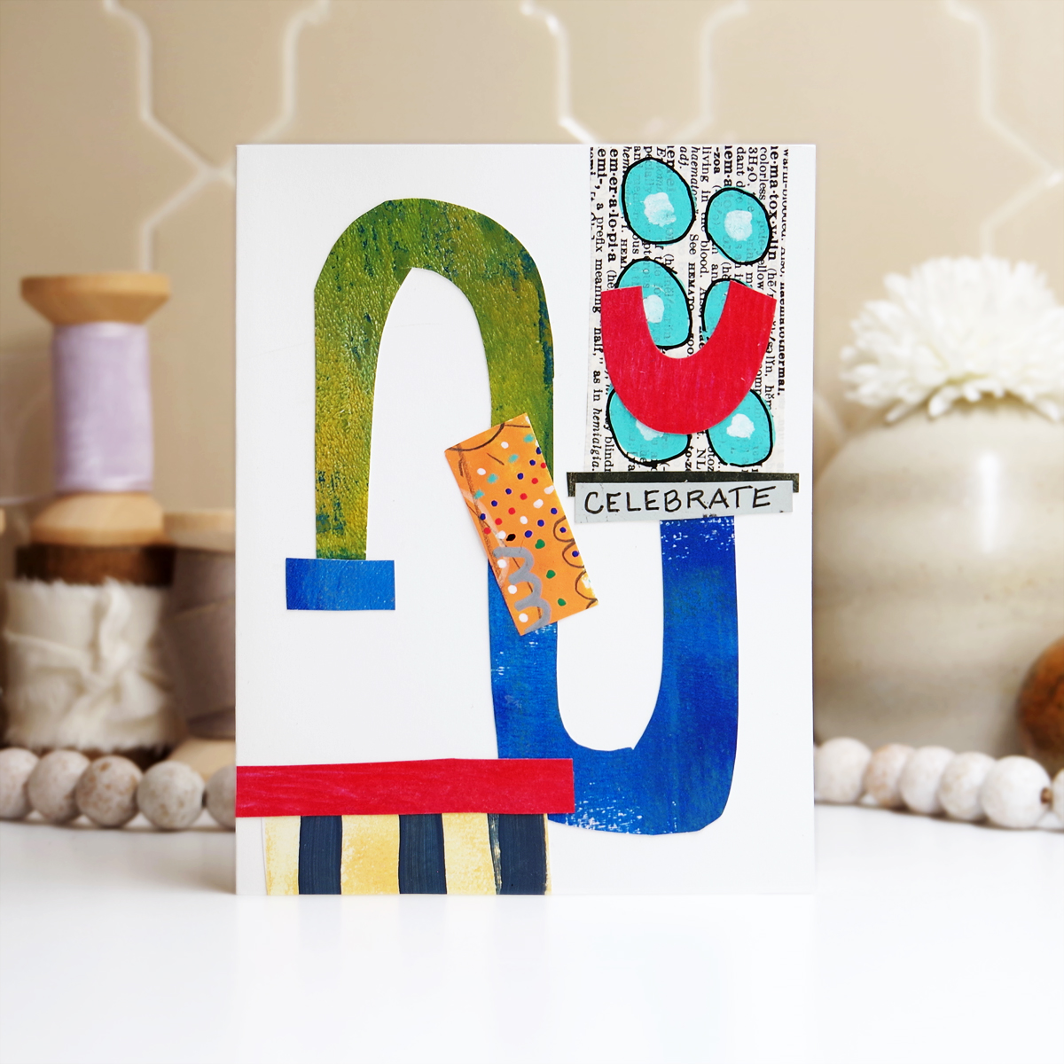 Easy DIY collage style birthday card made by cutting shapes from colored paper.