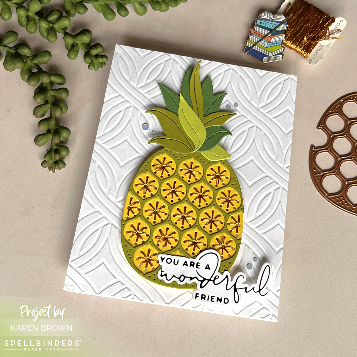 Die cut and hand stitched pineapple card in yellows, golds, and greens.